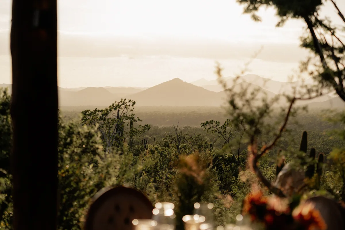 Desert and distant mountains seen from the estate terrace at dusk