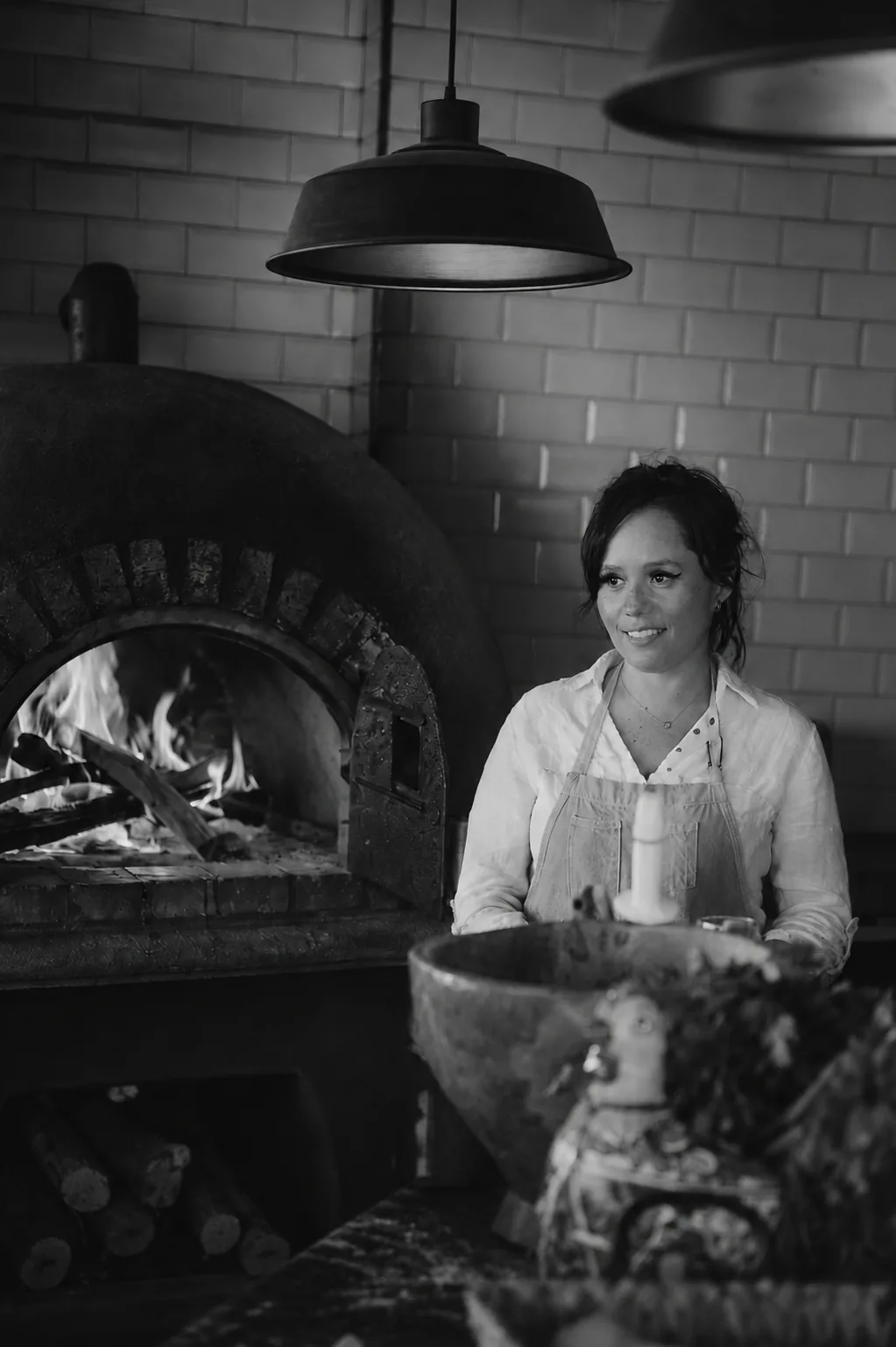 Co-founder Ourem Urdapilleta at the wood-fired oven of the estate kitchen